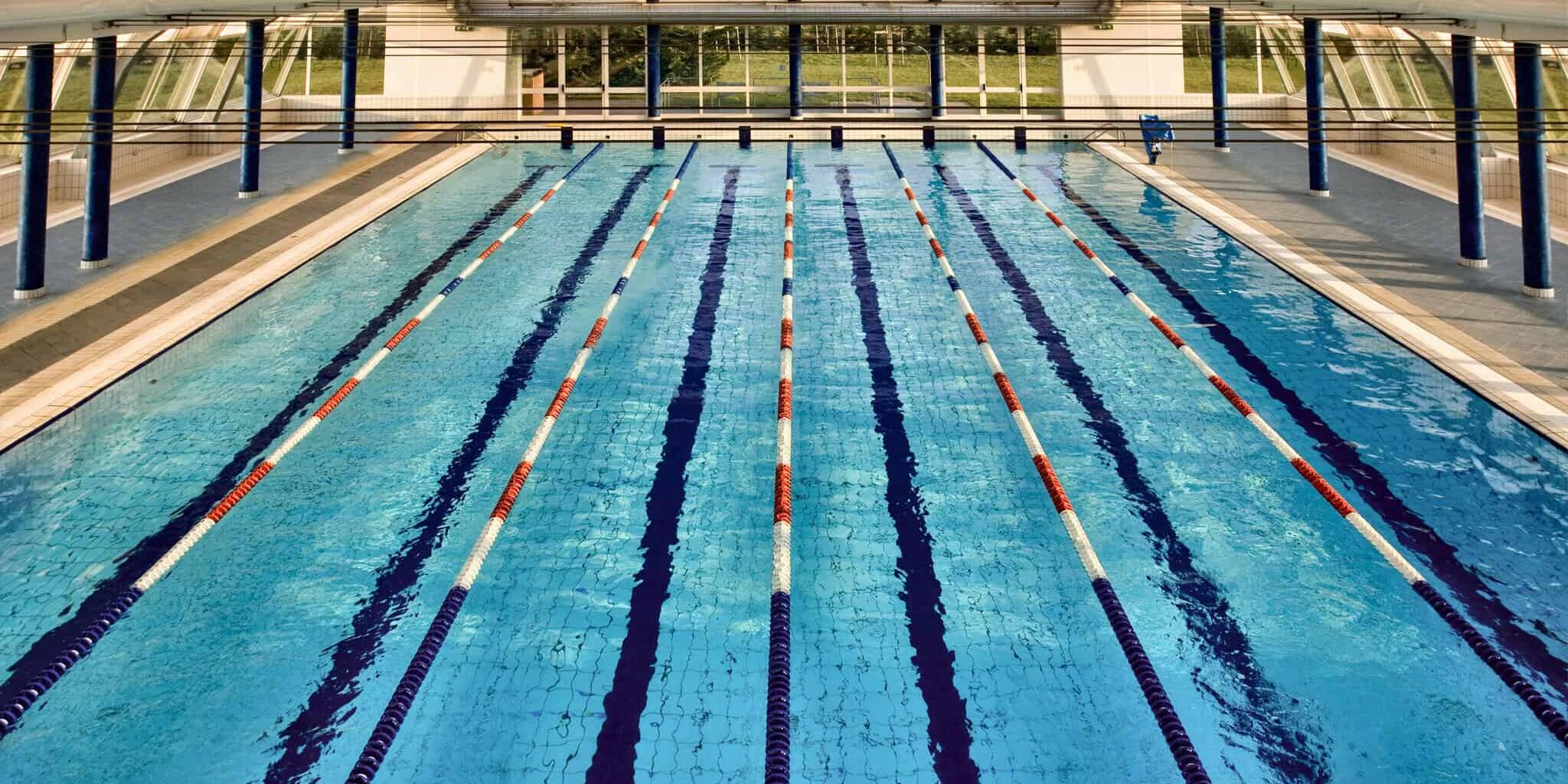 overhead view of lanes of swimming pool overhead view of lanes of swimming pool